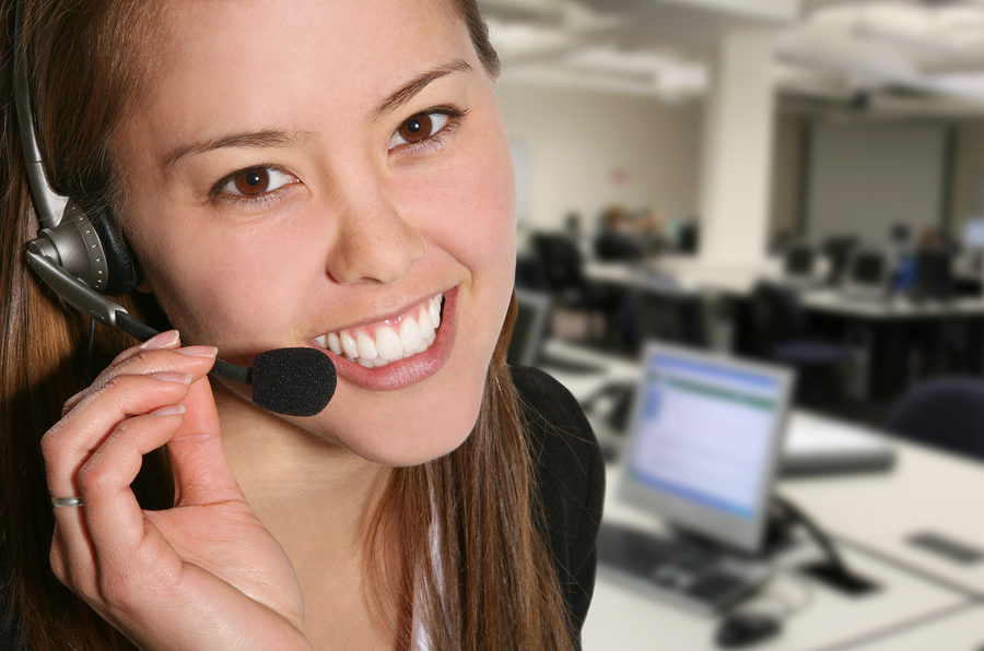 A pretty customer service woman taking sales over the phone