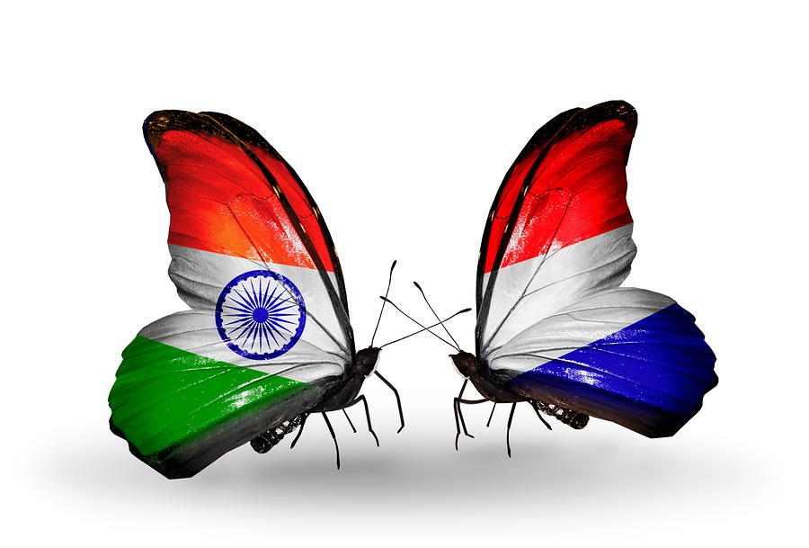 Two butterflies with flags on wings as symbol of relations India and Holland