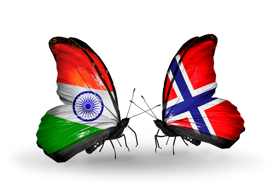 Two butterflies with flags on wings as symbol of relations India and Norway
