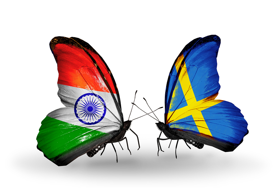 Two butterflies with flags on wings as symbol of relations India and Sweden